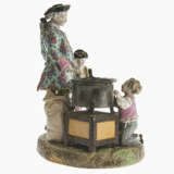 A porcelain group with chestnut seller and two putti - photo 2