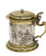 Silverware. A lidded tankard with scenes from the Emmaus story