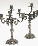 Silverware. A pair of girandoles