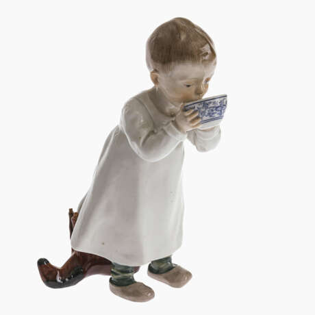 A Hentschel child drinking from a blue bowl - photo 1