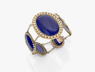 A bracelet with blue enamel and small natural pearls
