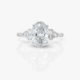 An eternity ring decorated with an oval 2.05-carat diamond and small brilliant-cut diamonds - photo 2