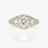 A ring with a brilliant-cut diamond - фото 2