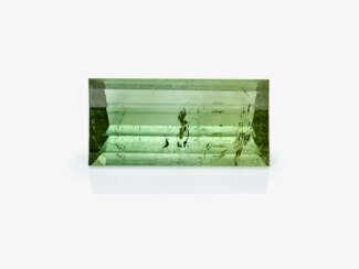 An unset green tourmaline weighing over 88 carats in a designer cut