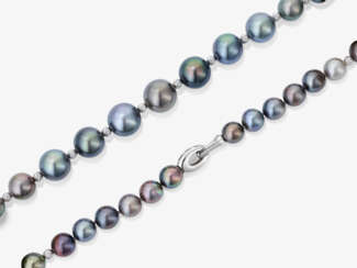 A Tahitian South Sea cultured pearl necklace with small diamond-studded intermediate balls