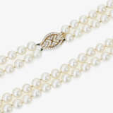 A two-strand Akoya cultured pearl necklace with diamond-studded clasp - photo 1