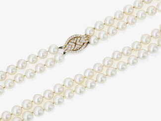 A two-strand Akoya cultured pearl necklace with diamond-studded clasp