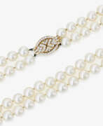 Neck jewellery. A two-strand Akoya cultured pearl necklace with diamond-studded clasp