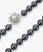 Neck jewellery. A haematite necklace with diamond clasp