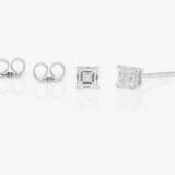 A pair of classic stud earrings set with square emerald-cut diamonds - фото 2