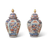 A PAIR OF JAPANESE PORCELAIN IMARI 'TEMPLE' JARS AND COVERS - photo 1