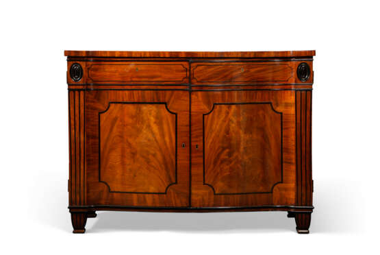 A REGENCY MAHOGANY AND PARCEL-EBONIZED COMMODE - photo 1