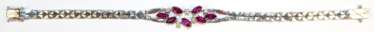 Rubin-Brillant-Armband, 585er WG, ausgefasst mit 7 Rubinen im facettierten Navetteschliff von zus. ca. 1,75 ct. und 5 Brillanten von zus. ca. 0,18 ct., LR-VVS, Kastenschloss mit 2 Sicherheitsachten, Ges.-Gew. 16,42 g, L…
