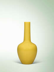 AN IMPERIAL YELLOW GLASS BOTTLE VASE