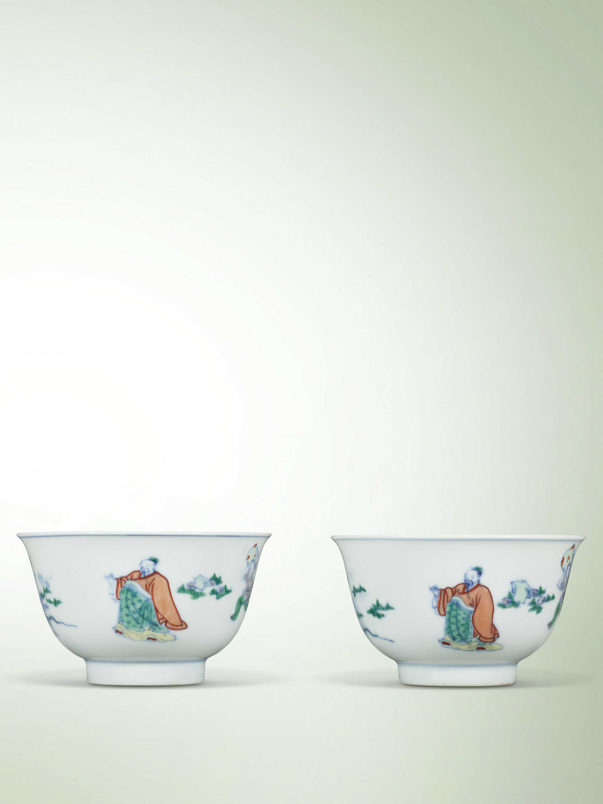 A FINE PAIR OF DOUCAI ‘FIGURAL’ TEA BOWLS