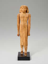 AN EGYPTIAN WOOD STRIDING OFFICIAL