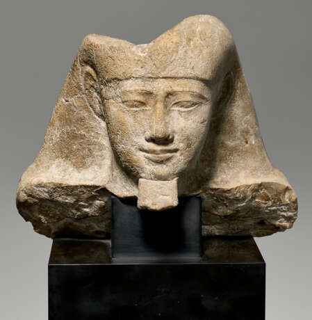 AN EGYPTIAN INDURATED LIMESTONE PORTRAIT HEAD OF AN OFFICIAL - photo 2 AN EGYPTIAN INDURATED LIMESTONE PORTRAIT HEAD OF AN OFFICIAL - photo 2