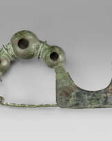 A GREEK BRONZE FIBULA