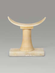 AN EGYPTIAN ALABASTER HEADREST