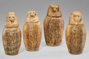 A SET OF FOUR EGYPTIAN ALABASTER CANOPIC JARS FOR KHAKARE