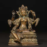 A GILT COPPER ALLOY FIGURE OF VASUDHARA - photo 1