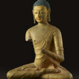 A GILT AND POLYCHROME STUCCO FIGURE OF BUDDHA - фото 1