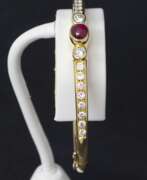 Overview. Gold bracelet with diamonds and rubies