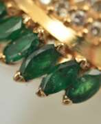 Product catalog. Gold ring with emeralds and diamonds