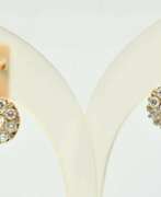 Overview. Gold earrings with diamonds