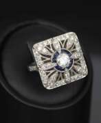 Overview. Gold ring with diamonds and sapphires