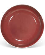 Porcelain. A COPPER-RED-GLAZED DISH
