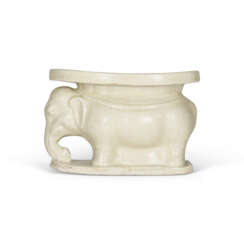 A WHITE-GLAZED ELEPHANT-SHAPED PILLOW