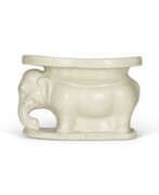 Tang dynasty. A WHITE-GLAZED ELEPHANT-SHAPED PILLOW