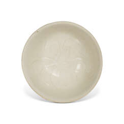 A DING WHITE-GLAZED CARVED 'FLORAL' BOWL