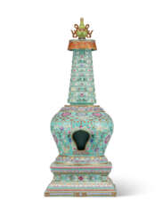 A TURQUOISE-GROUND FAMILLE ROSE ‘LOTUS’ BUDDHIST STUPA