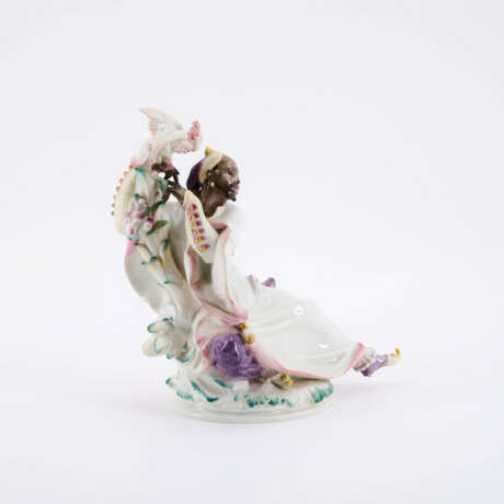 PORCELAIN FIGURINE OF BLACK PERSON WITH COCKATOO - photo 1