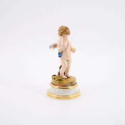 PORCELAIN FIGURINE OF CUPID, SCRATCHING BEHIND HIS EAR