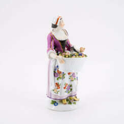 PORCELAIN FIGURINE OF A GARDENER WITH BASKET