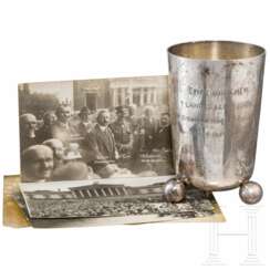 A silver cup of the 1st Shooting Competition of the Bavarian "Einwohnerwehr" and four photos