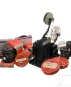 Books about history. An Agfa Record narrow-gauge film projector with approx. 30 films