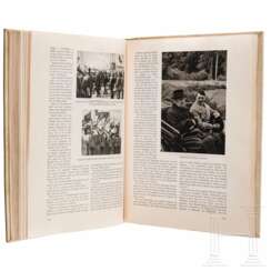 A cigarette card album "Deutschland erwacht" in a luxury parchment-bound edition