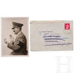 Adolf Hitler - a signed Hoffmann postcard in an envelope addressed to a "Jungmädel"