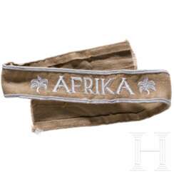 A cuff title "Afrika"