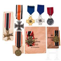 A medal grouping, partly with bag of issue and packing paper, never worn