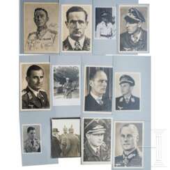 A collection of signed Knight's Cross winner postcards and photos