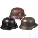 A fire brigade steel helmet M34, two Heer steel helmets M35 and M42 - photo 1