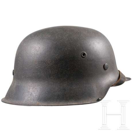 A Luftwaffe steel helmet M 42 and a belt - photo 2 A Luftwaffe steel helmet M 42 and a belt - photo 2