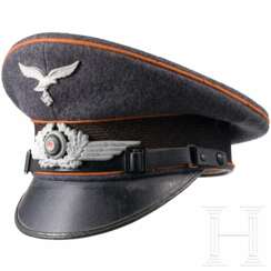 A visor cap for EM/NCOs of the Luftwaffe signal corps