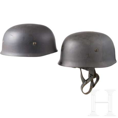 Three replica steel helmets M 38 for paratroopers - photo 2 Three replica steel helmets M 38 for paratroopers - photo 2