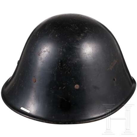 A Dutch M 34 steel helmet used by the police - фото 4